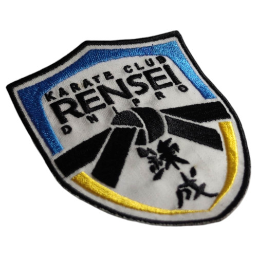 Нашивка Rensei Karate Club | Щит с эмблемой клуба каратэ RENSEI и силуэтом каратиста. |